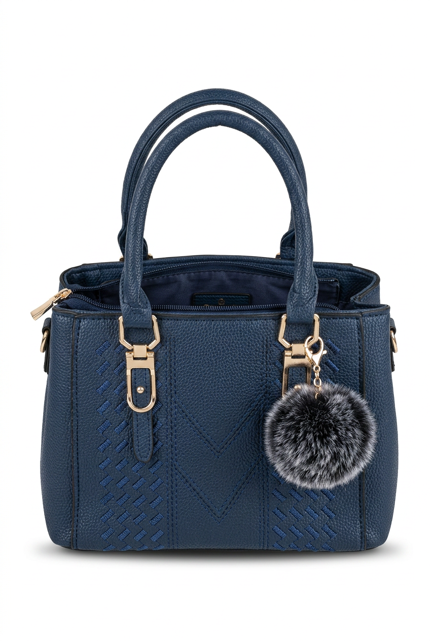 Elevate Your Style with Our Classic Black Top-Handle Handbag in navy with a charm, perfect for day-to-night elegance.