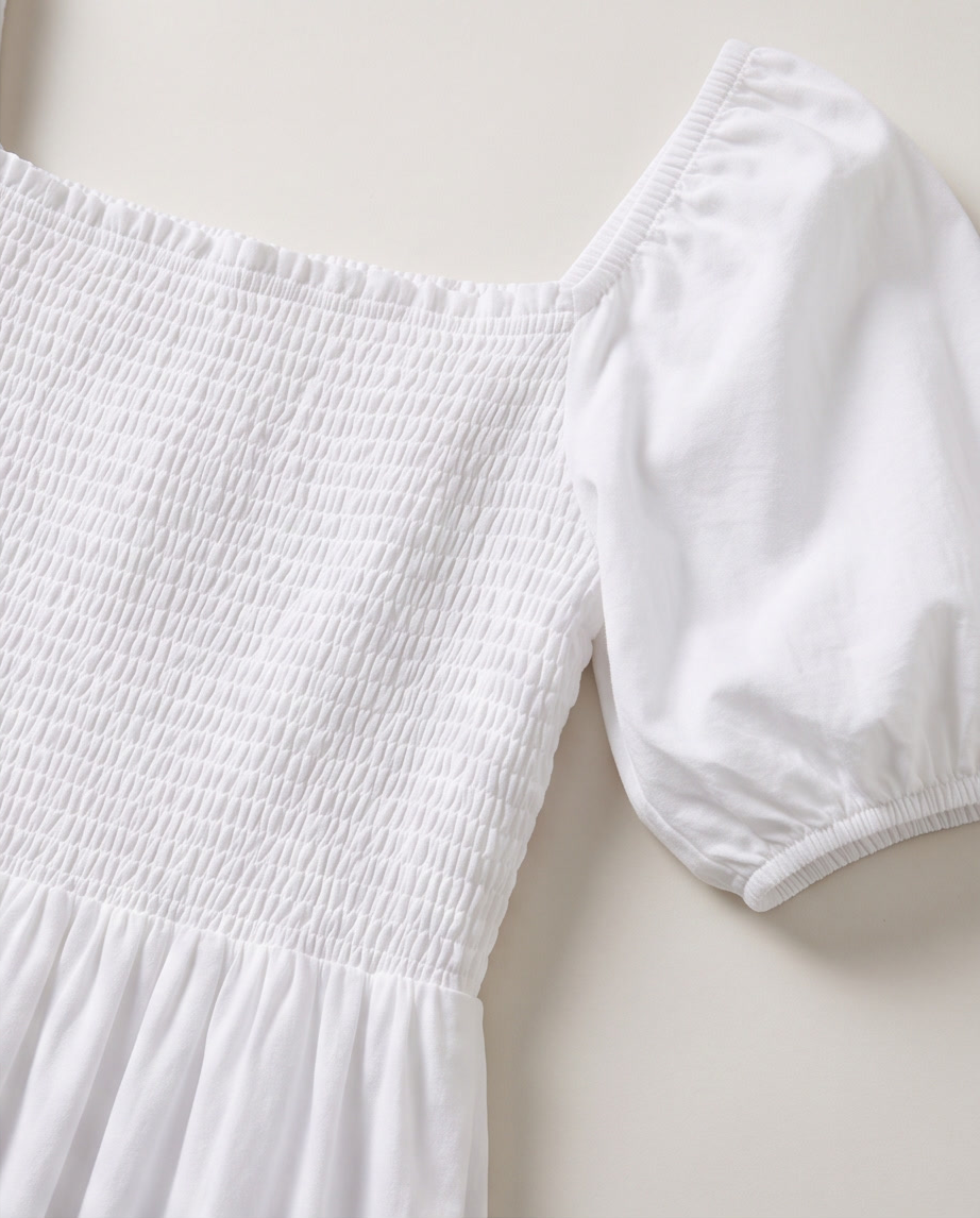 Square-Neck Puff-Sleeve Smocked Maxi Dress detail with smocked bodice and puff sleeves in white.
