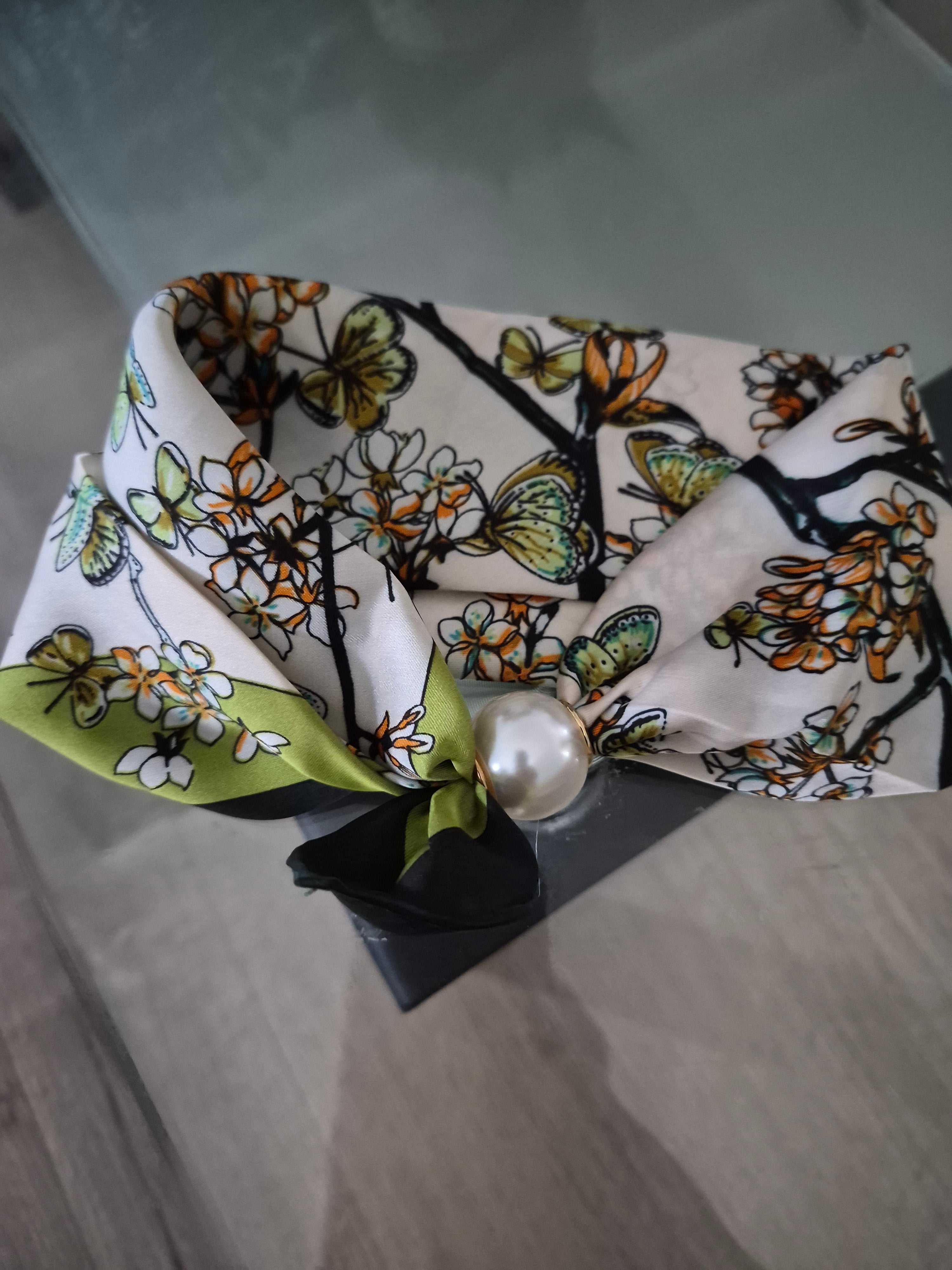 Aria Floral Silk-Feeling Neckerchief Scarf with a Pearl Slide displayed on a flat surface.
